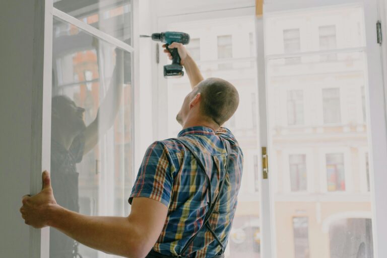 Handyman installing door fixture in Hamilton