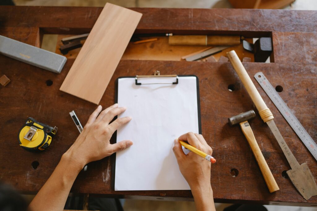 Handyman working with tools and wood in Hamilton